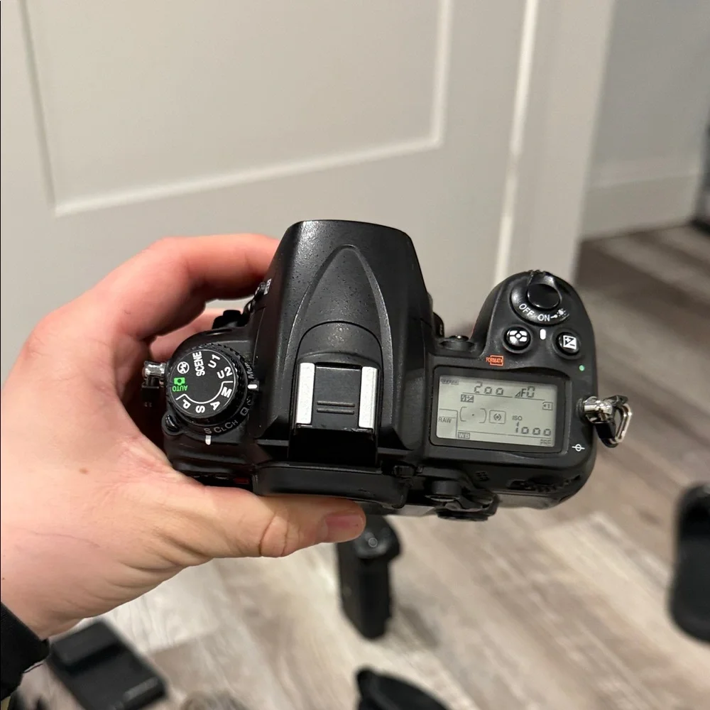 Nikon DSLR D7000 Camera with Black Battery Grip and Accessories